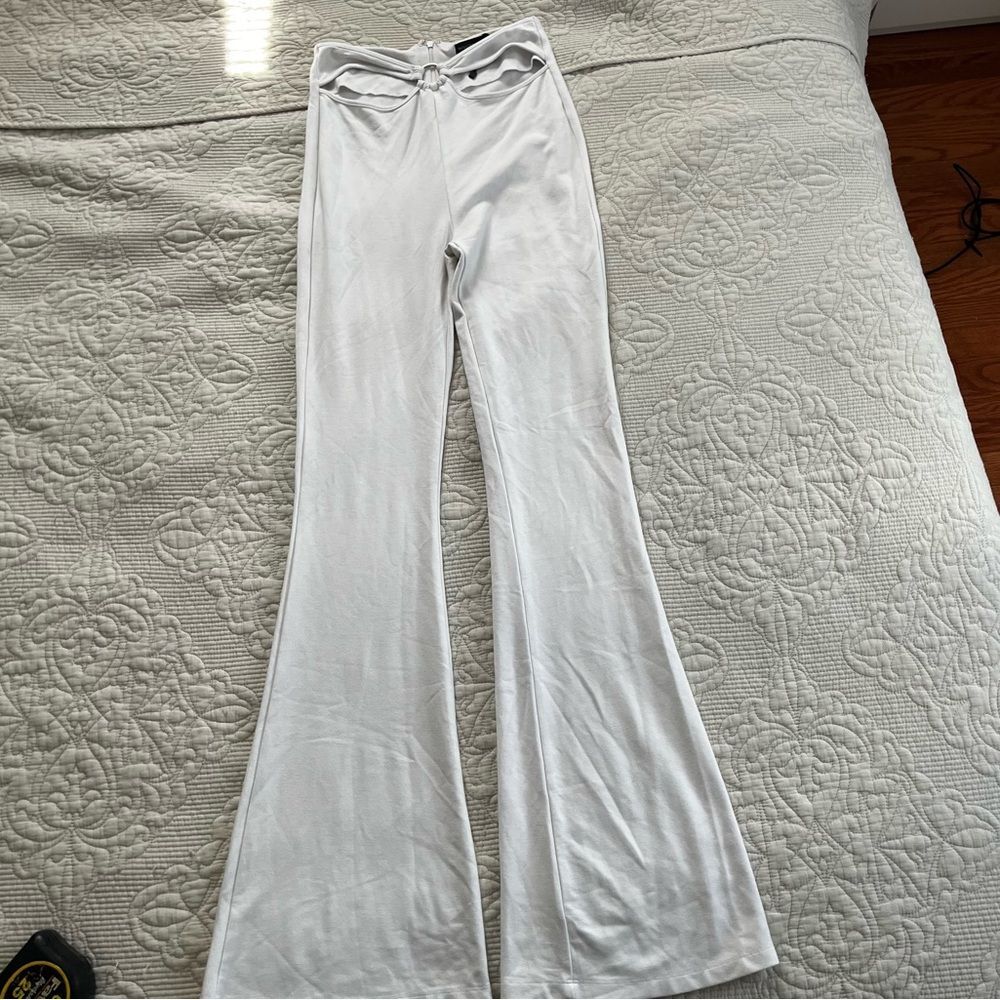 White fox boutique white cut out flare pants size small